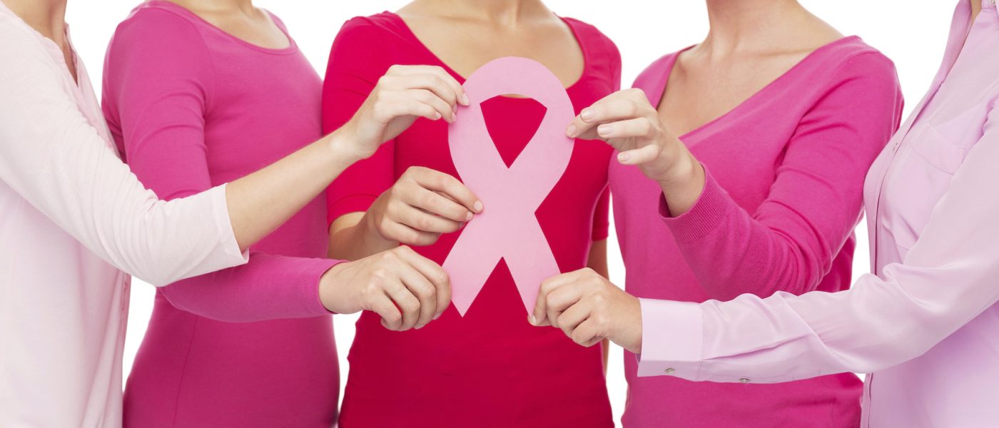 healthcare, people and medicine concept - close up of women in blank shirts with pink breast cancer awareness ribbon over white background